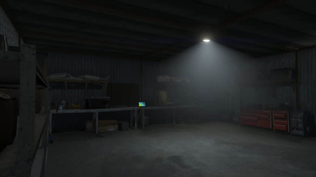 Das dunkle Innere einer billigen Garage in GTA Online mit einem Laptop.
