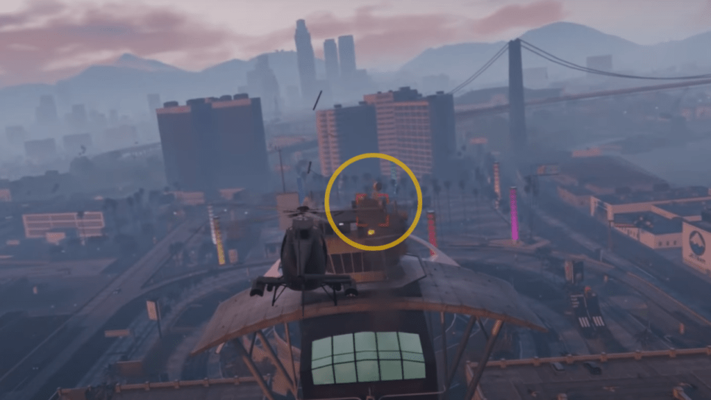 The Buzzard approaching the control tower near the Los Santos International Airport in GTA Online.
