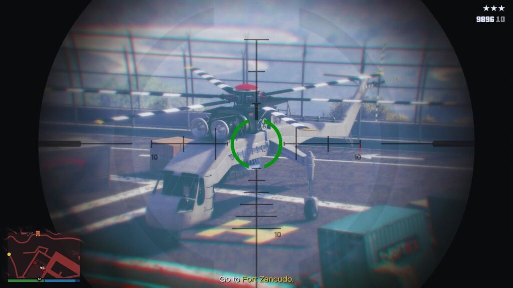 A Sniper Rifle's crosshair highlighting the Skylift helicopter in a military base in GTA Online.