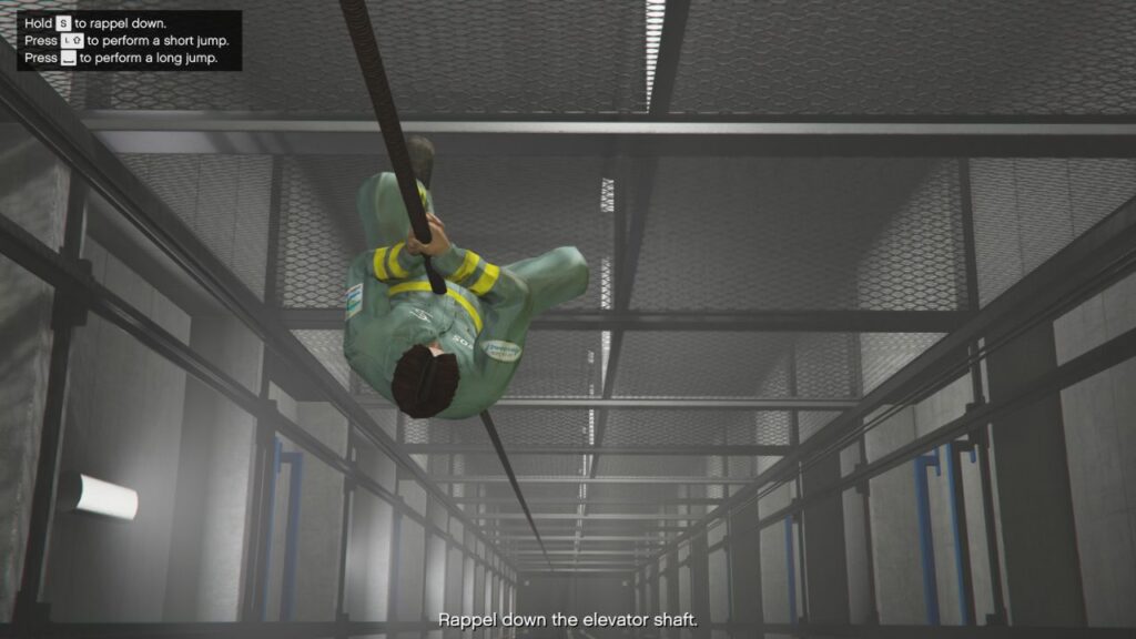 The player going down the Elevator Shaft during the Podium Robbery in GTA Online.